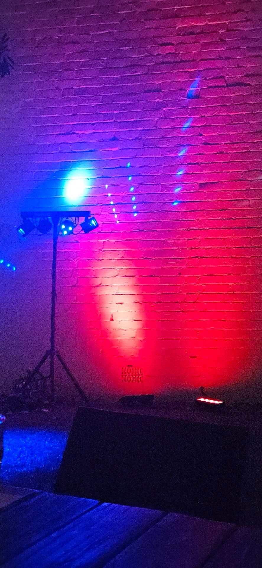 Coloured LED uplighting installed at an event venue